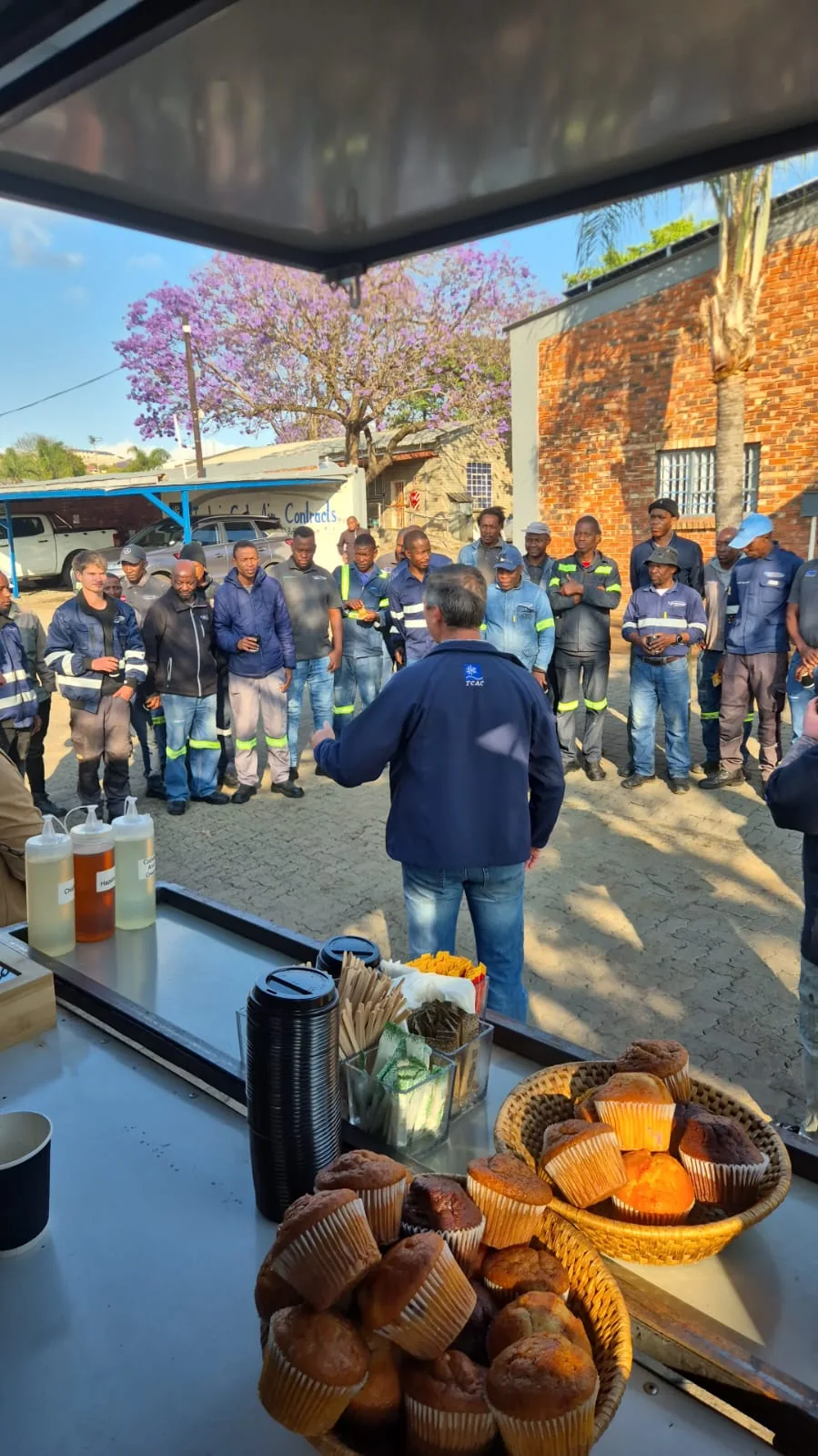 Guests gathering for coffee at an outdoor event